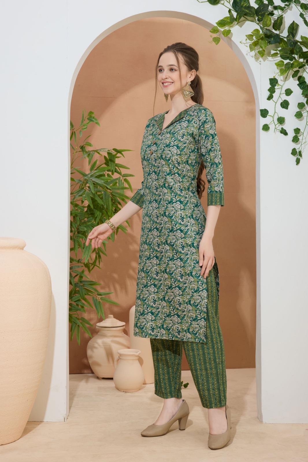 Gorgeous Green Kurti Pant Suit For Women With Coat Collar. Embellished with Decorative Buttons and Thread Work.