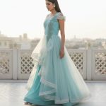 light blue net gown featuring ruffled tiers and delicate embroidery