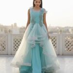 light blue net gown featuring ruffled tiers and delicate embroidery