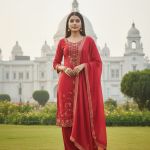 Red embroidered kurta set with a dupatta.