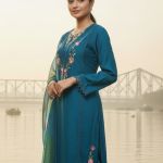 Teal blue embroidered kurta and pant set with a printed dupatta.