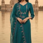 Teal blue embroidered kurta set with trousers and a dupatta.